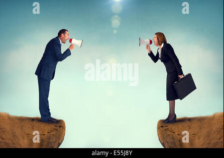 business concept conflict megaphone businessman and businesswoman Stock Photo