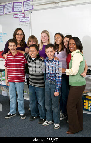 Boys girls school class Interracial Smiling Multi racial racially ethnically diverse Group students 11-13 year years old teacher MR © Myrleen Pearson Stock Photo