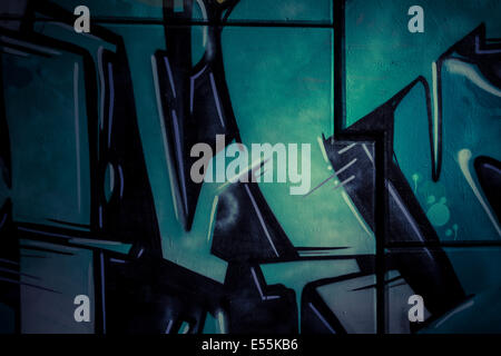 Blue ice, colorful graffiti, abstract grunge grafiti background over textured wall Stock Photo