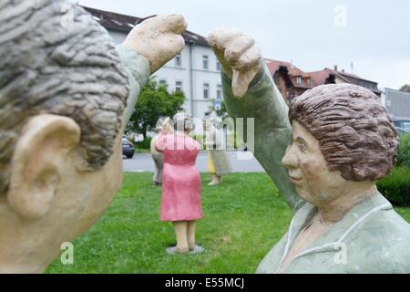 Mosbach, Germany. 21st July, 2014. 'Everyday People' ('Alltagsmenschen'), statues by artist Christel Lechner, have been put up in public spaces in Mosbach, Germany, 21 July 2014. Around 60 of the concrete statues will be on display till the middle of October. Photo: CHRISTINE CORNELIUS/DPA/Alamy Live News Stock Photo