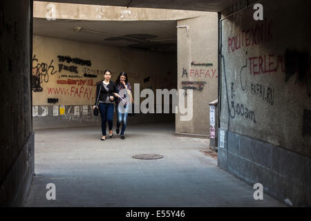 Two girls walking in a pedestrian tunnel in Yerevan, Armenia Stock Photo