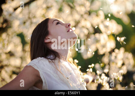 Portrait of a young woman with cherry blossoms Stock Photo