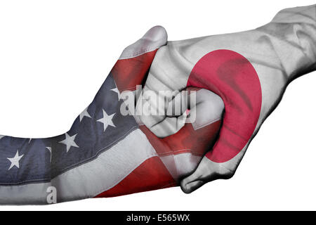 Diplomatic handshake between countries: flags of United States and Japan overprinted the two hands Stock Photo