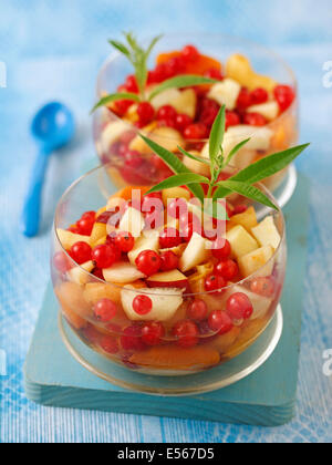 Fruit salad with stevia and lemon verbena. Recipe available. Stock Photo