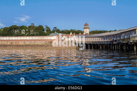 Victorian Train Station at Wemyss Bay with covered pier leading to ferry terminal, viewed from a kayak on the Firth of Clyde. Stock Photo