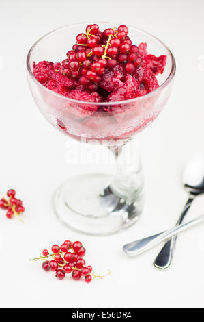 Delicious raspberry sorbet in glass on white background Stock Photo