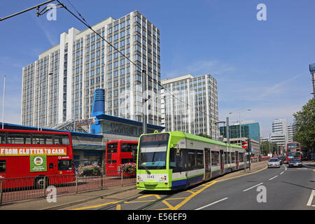 A Tram on the Croydon Tramlink system travels on Wellesley Road in Croydon town centre Stock Photo