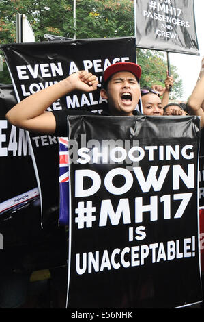 Kuala Lumpur. 22nd July, 2014. Protesters shout slogans demanding justice for the victims of Malaysia Airlines Flight MH17 at a rally held by Malaysia's ruling United Malays National Organization (UMNO)'s youth wing outside the Russian embassy and United Nations office in Kuala Lumpur July 22, 2014. Rallies are held by UMNO's youth wing outside Russian and Ukrainian embassies in Kuala Lumpur, demanding a justice investigation of the crash of Malaysian Airlines Flight MH17. Credit:  Chong Voon Chung/Xinhua/Alamy Live News Stock Photo