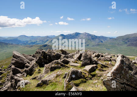 View from Moel Siabod rocky top summit to distant Snowdon horseshoe mountains in Snowdonia National Park North Wales UK Britain Stock Photo