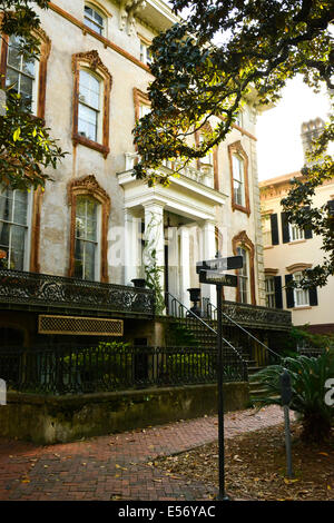 Restored, refined residential architecture and gardens delight throughout the historical Victorian district of Savannah, Georgia Stock Photo