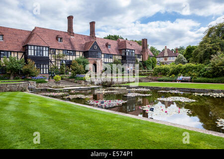 Grade ll listed laboratory building and waterlily pond and canal in Summer at Wisley RHS Gardens, Surrey Stock Photo