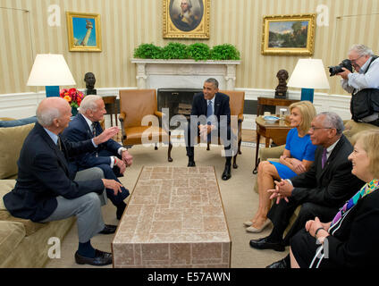 Washington DC, USA. 22nd July, 2014. United States President Barack Obama meets representatives of Apollo 11 to recognize the 45th anniversary of the first manned landing on the Moon in the Oval Office of the White House in Washington, D.C. on Tuesday, July 22, 2014. Credit: Ron Sachs / Pool via CNP/dpa/Alamy Live News Stock Photo