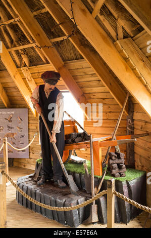 Diorama of bog worker cutting turf at the Lullymore heritage and Discovery Park, rathangan, Kildare, Ireland. Stock Photo