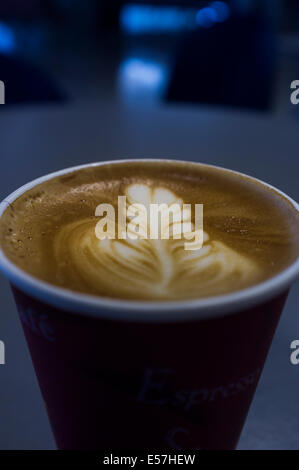 Cappucino coffee in take away paper cup. Stock Photo