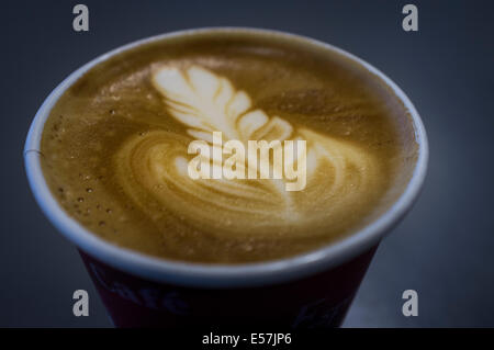 Cappucino coffee in take away paper cup. Stock Photo