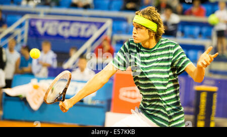 Umag, Croatia. 22nd July 2014, Umag (Croatia) - German Tennis Player Alexander Zverev is hitting a backhand at the Vegetea Croatian Open 2014 in Umag. He plays his first round match against Spaniard Albert Montanes. Credit:  Janine Lang/Alamy Live News Stock Photo