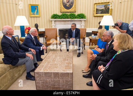 Washington, D.C., US. 22nd July, 2014. US President Barack Obama meets with Apollo 11 astronauts Michael Collins, seated left, Buzz Aldrin, Carol Armstrong, widow of Apollo 11 commander, Neil Armstrong, NASA Administrator Charles Bolden, and Patricia Falcone, OSTP Associate Director for National Security & International Affairs, far right, in the Oval Office of the White House July 22, 2014 in Washington, DC. Obama welcomed the astronauts on the 45th anniversary week of the Apollo 11 lunar landing. Credit:  Planetpix/Alamy Live News Stock Photo