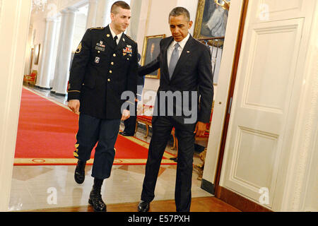 Washington, DC, US. 21st July, 2014. US President Barack Obama escorts former Army Staff Sgt. Ryan Pitts into the East Room of the White House for the Medal of Honor ceremony July 21, 2014 in Washington, DC. Credit:  Planetpix/Alamy Live News Stock Photo