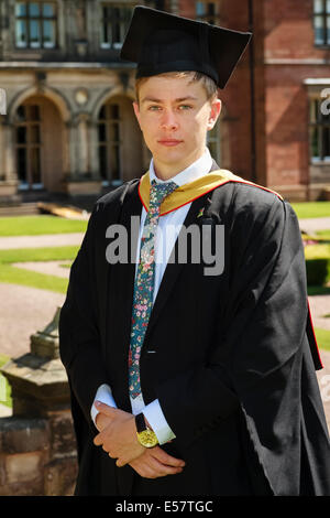 University student poses in traditional mortar board and gown on graduation day, Keele University, UK Stock Photo
