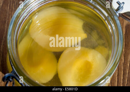 Canned pear in a glass jar. Top view Stock Photo