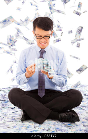 business man counting money with money rain background Stock Photo