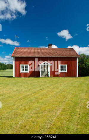 House painted Falu red, Smaland, Sweden Stock Photo