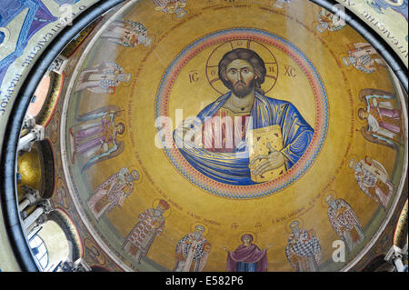 Directly above the Catholicon, a view of the Christ Pantocrator in the dome of the Church of the Holy Sepulchre. Stock Photo