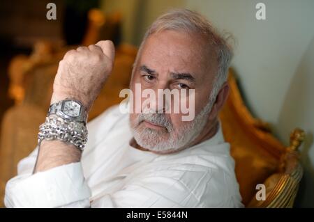 FILE - Hairdresser Udo Walz poses at his hair salon in Berlin, Germany, 16 July 2014. Walz will turn 70 on 28 July 2014. Photo: BRITTA PEDERSEN/dpa Stock Photo