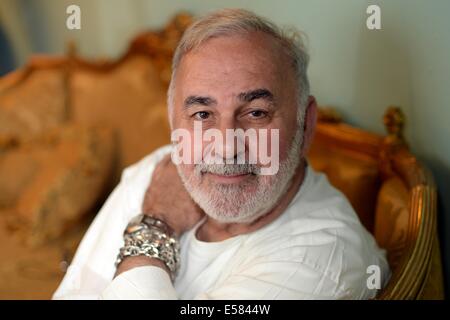 FILE - Hairdresser Udo Walz poses at his hair salon in Berlin, Germany, 16 July 2014. Walz will turn 70 on 28 July 2014. Photo: BRITTA PEDERSEN/dpa Stock Photo