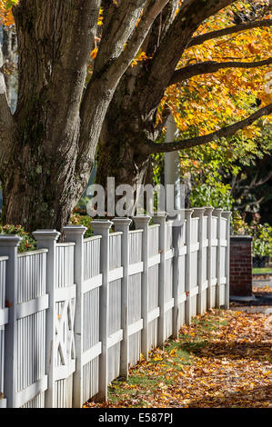 Charming white picket fence with autumn color, Woodstock, Vermont, USA Stock Photo