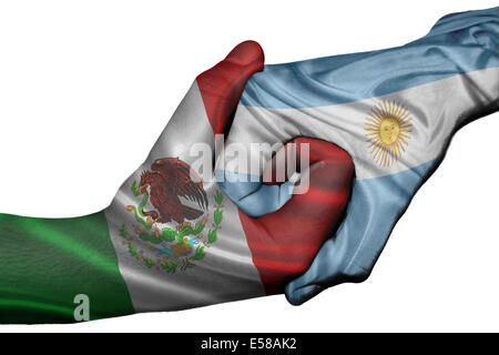 Diplomatic handshake between countries: flags of Mexico and Argentina overprinted the two hands Stock Photo