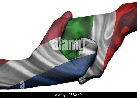 Diplomatic handshake between countries: flags of Netherlands and Italy overprinted the two hands Stock Photo