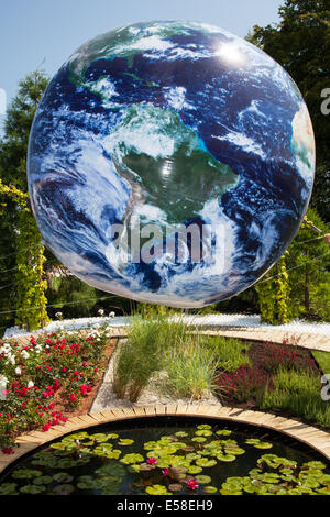 Blue Planet Earth Globe in Tatton Park, Manchester, UK. July, 2014. Circular images of Tethered Earth  Jonathen Price "Silver Medal" garden room, Inflatable floating Bubble Globe Balloon. Best in show winner at the RHS - Royal Horticultural Society themed event at Tatton Park. Stock Photo