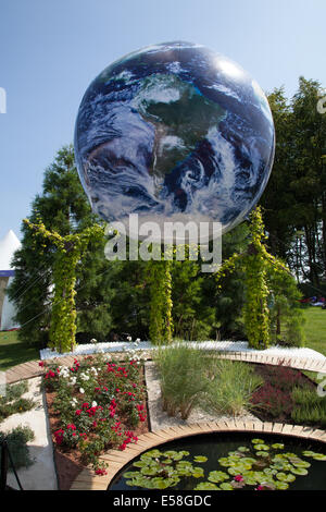 Blue Planet Earth Globe in Tatton Park, Manchester, UK. July, 2014. Circular images of Tethered Earth  Jonathen Price "Silver Medal" garden room, Inflatable floating Bubble Globe Balloon. Best in show winner at the RHS - Royal Horticultural Society themed event at Tatton Park. Stock Photo