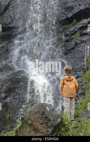 young boy looking at Radau Waterfall, Bad Harzburg, Lower Saxony, Germany Stock Photo