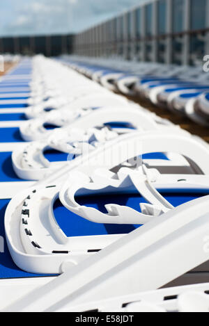 Row of empty sun loungers on the P&O cruise liner MV Arcadia Stock Photo