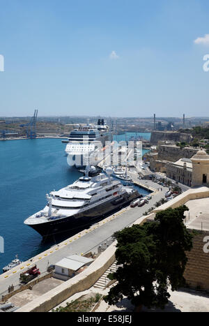 Octopus  Super Yacht owned by Microsofts Paul Allen moored in Grand Harbour with Pilot boat ahead and cruise liner astern Stock Photo