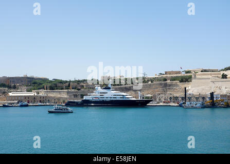 Octopus  Super Yacht owned by Microsofts Paul Allen moored in Valletta Grand Harbour viewed by tourists on a harbour cruise Stock Photo