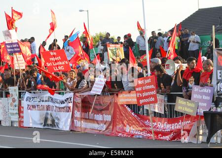 Glasgow, Scotland, UK. 23rd July 2014. Outside Celtic Park during the opening ceremony a large crowd noisily but peacefully protest against the treatment of Sri Lankans.  They are lobbying for the creation of an independent state, Tamil Eelam, and the suspension of Sri Lanka from the Commonwealth Credit:  Neville Styles/Alamy Live News Stock Photo