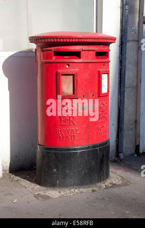 Modern pillar style red British post box in Kentish Town Stock Photo