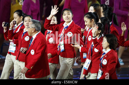 Glasgow, Scotland, UK. 23rd July, 2014. The delegation of Singapore march in during the Opening Ceremony for the XX Commonwealth Games at the Celtic Park in Glasgow, Britain, on July 23, 2014. Credit:  Wang Lili/Xinhua/Alamy Live News Stock Photo