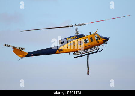 Aerial fire fighting a bush fire using water bomber helicopter in Western Australia. Stock Photo