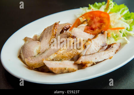 Roasted pork on the table in the restaurant. Stock Photo