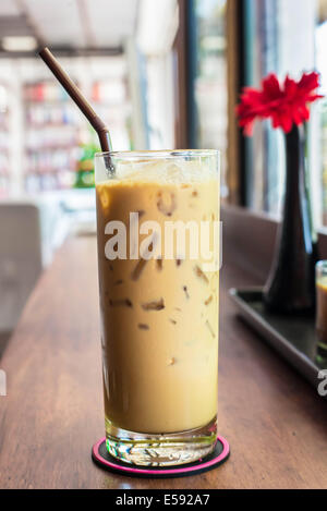 Iced coffee on the wooden table in coffee cafe. Stock Photo
