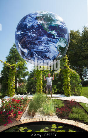 Blue Planet Earth Globe in Tatton Park, Manchester, UK. July, 2014. Circular images of Tethered Earth  Jonathen Price "Silver Medal" garden room, Inflatable floating Bubble Globe Balloon. Best in show winner at the RHS - Royal Horticultural Society themed event at Tatton Park. Stock Photo
