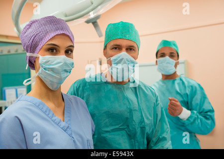 Medical professionals in an operating room Stock Photo
