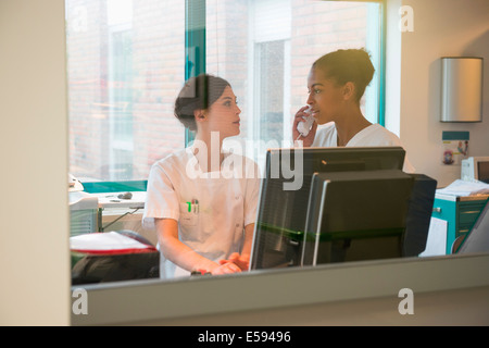 Two female nurses working in office Stock Photo