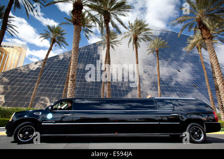 Hummer stretch limo in front of the pyramid of the Luxor hotel and casino, in March 2012. The pyramid is 111m/365foot high. Stock Photo