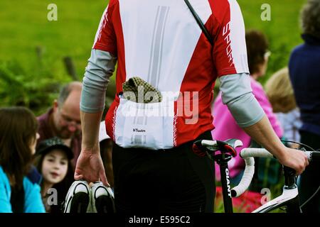 Cyclist with a traditional flat cap in rear pocket of cycling vest on 2014 Tour de France route south Yorkshire England Europe Stock Photo