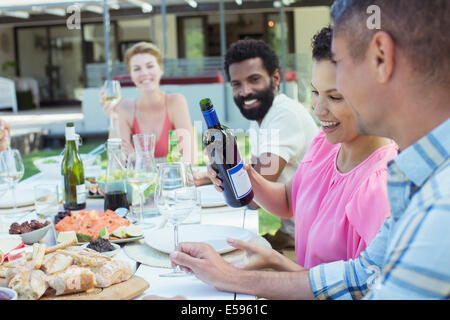 Friends eating together outdoors Stock Photo